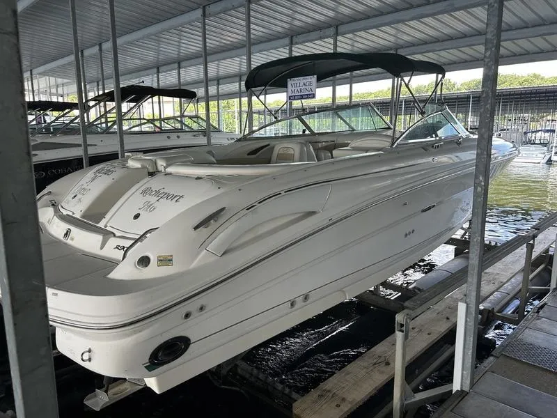 Slide: The Image of 2002 Sea Ray 290 boat docked in a covered marina. - 5