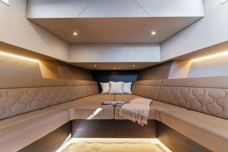 Slide: The Image of Luxurious interior of 2021 Vanquish VQ58 yacht with plush seating and ambient lighting. - 20