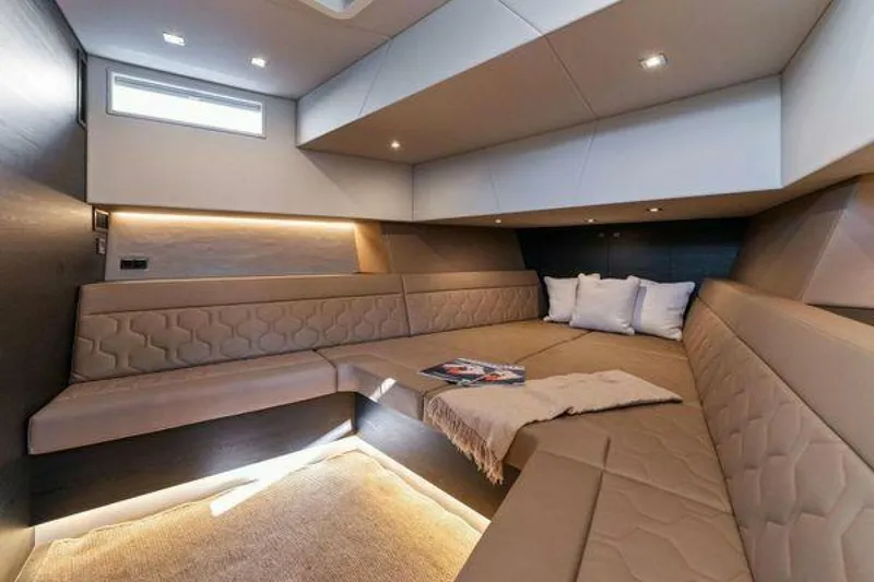 Slide: The Image of Luxurious interior of 2021 Vanquish VQ58 yacht with plush seating and modern lighting. - 22