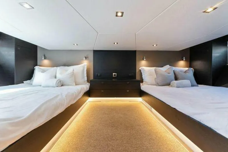Slide: The Image of Luxurious 2021 Vanquish VQ58 yacht bedroom with twin beds and ambient lighting. - 23