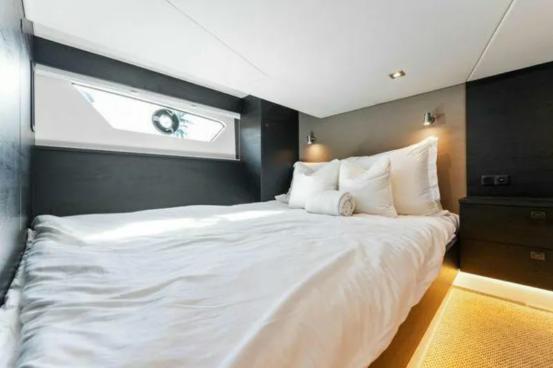 Slide: The Image of Luxurious bedroom interior of 2021 Vanquish VQ58 yacht with modern design and cozy bedding. - 25