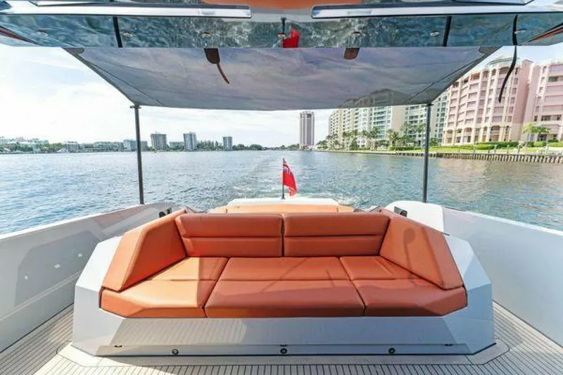Slide: The Image of Luxury Vanquish VQ58 yacht with orange seating, waterfront view, 2021 model. - 31
