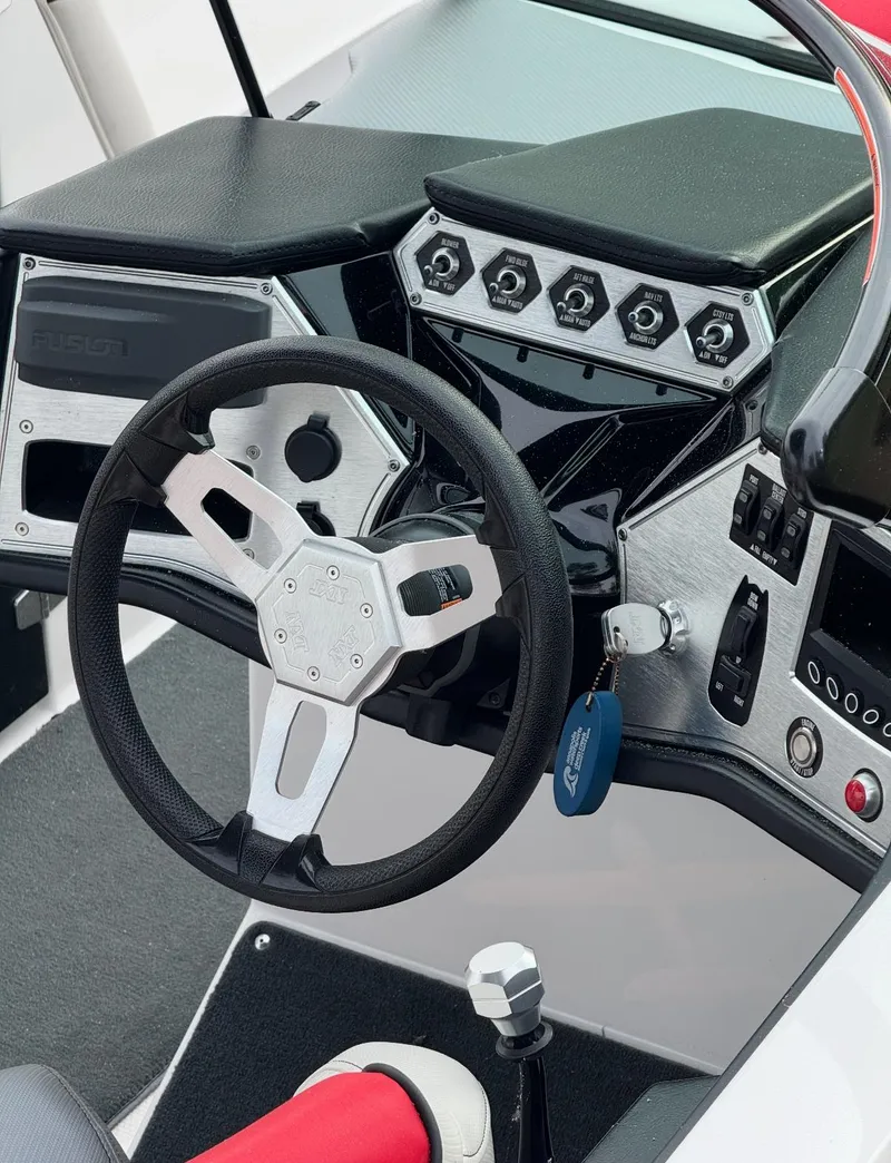 Slide: The Image of 2017 MasterCraft NXT22 boat dashboard with steering wheel and control panel. - 6