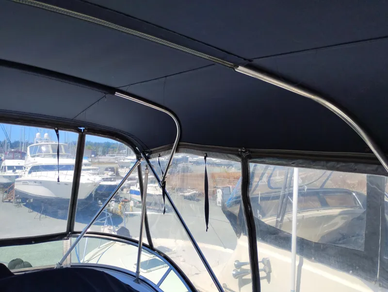 Slide: The Image of 2001 Bayliner 3488 Command Bridge Motoryacht interior with marina view. - 14