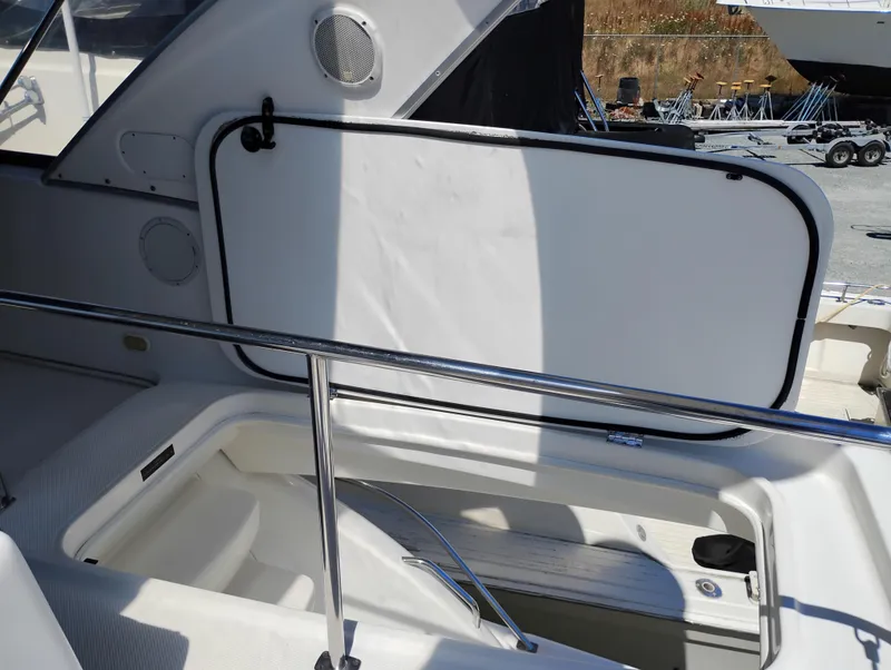Slide: The Image of 2001 Bayliner 3488 Command Bridge Motoryacht interior with open hatch and railing. - 23