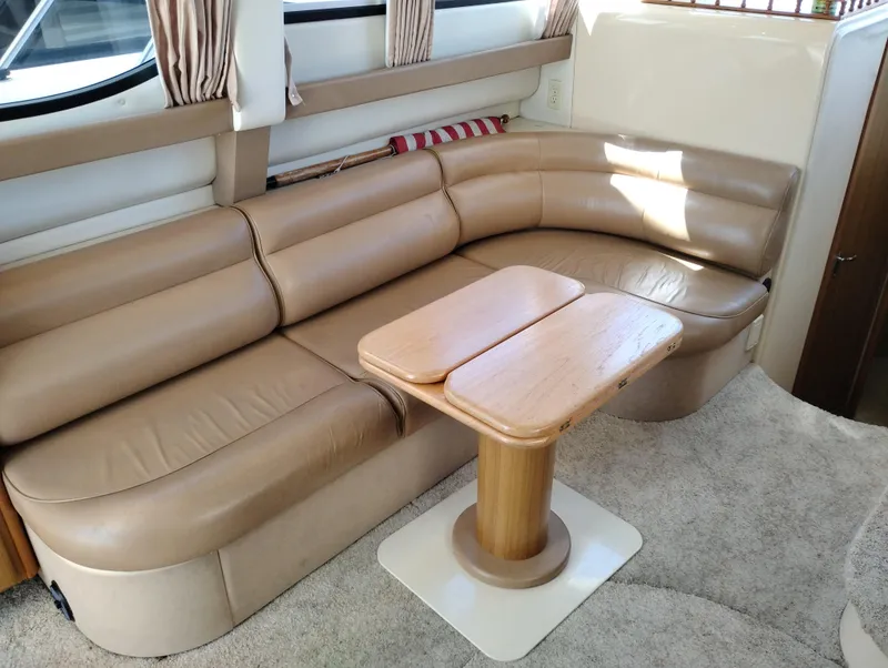 Slide: The Image of Luxurious interior of 2001 Bayliner 3488 Command Bridge Motoryacht with beige leather seating. - 25