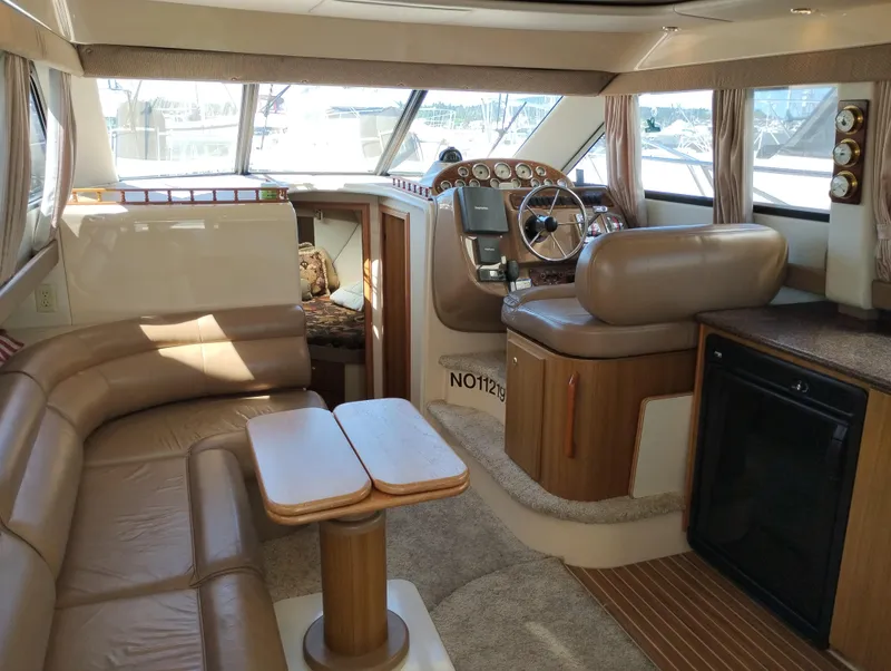 Slide: The Image of Interior of 2001 Bayliner 3488 Command Bridge Motoryacht with leather seating and helm. - 26