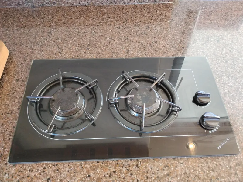 Slide: The Image of Two-burner gas stove on granite countertop in 2001 Bayliner 3488 Command Bridge Motoryacht. - 30