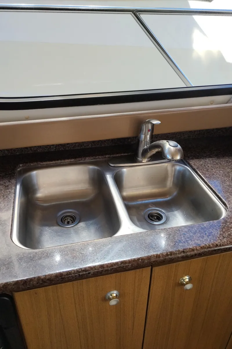 Slide: The Image of Double sink in 2001 Bayliner 3488 Command Bridge Motoryacht kitchen area. - 31