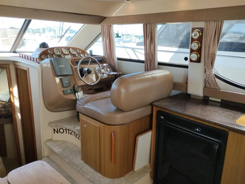 Slide: The Image of Interior of 2001 Bayliner 3488 Command Bridge Motoryacht with helm and seating area. - 34