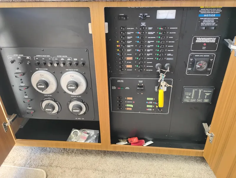 Slide: The Image of Electrical control panel of a 2001 Bayliner 3488 Command Bridge Motoryacht, featuring switches and gauges. - 39