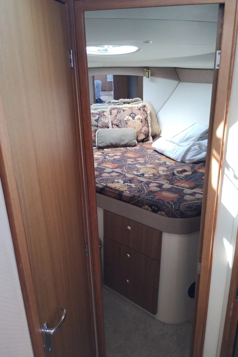 Slide: The Image of Interior cabin of 2001 Bayliner 3488 Command Bridge Motoryacht with cozy bed and storage. - 47