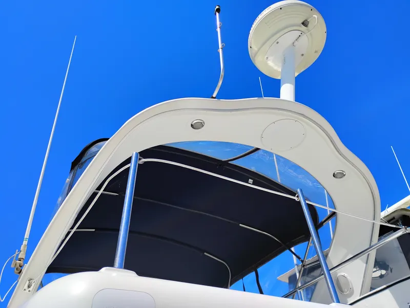 Slide: The Image of 2001 Bayliner 3488 Command Bridge Motoryacht against clear blue sky. - 7