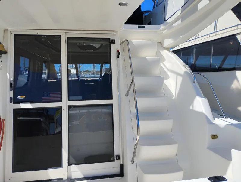 Slide: The Image of 2001 Bayliner 3488 Command Bridge Motoryacht with stairs and sliding glass doors. - 8