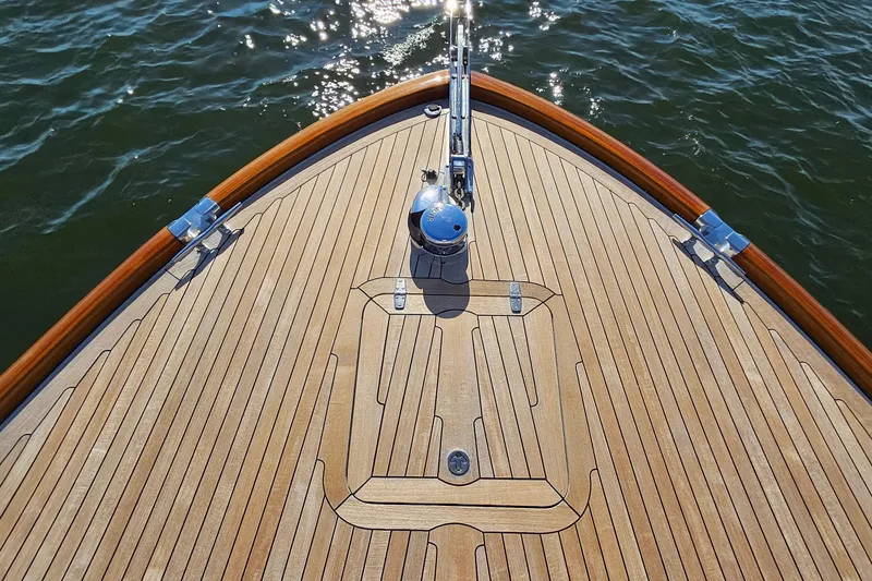 Slide: The Image of Bow of 2005 San Juan SJ 48 Flybridge yacht with teak decking on water. - 27