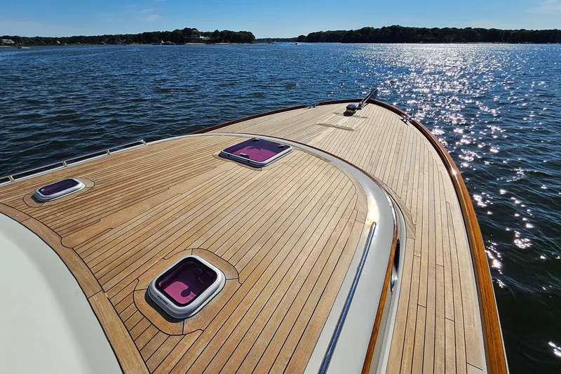 Slide: The Image of San Juan SJ 48 Flybridge 2005 yacht deck on sparkling water, sunny day. - 28
