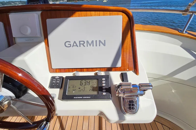 Slide: The Image of Helm of 2005 San Juan SJ 48 Flybridge with Garmin navigation system and electronic controls. - 42