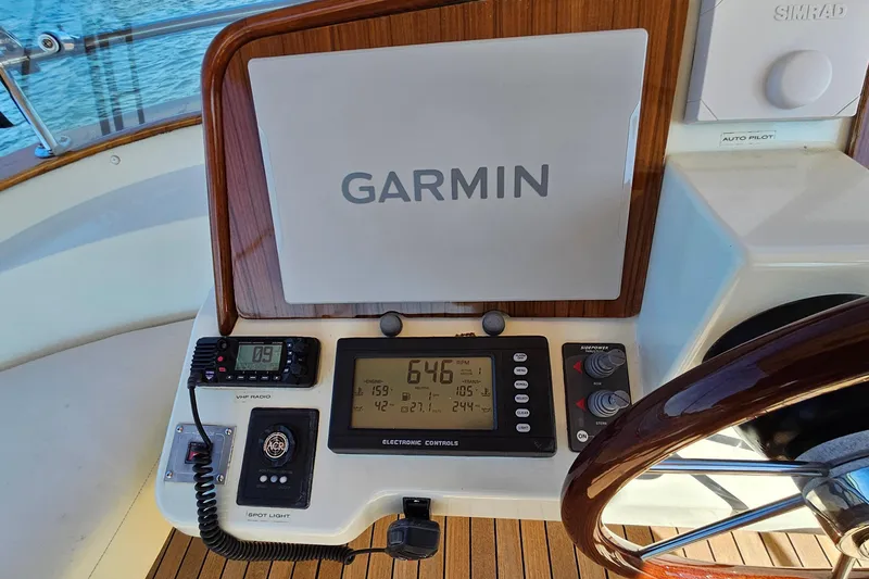 Slide: The Image of Helm of 2005 San Juan SJ 48 Flybridge with Garmin navigation system and controls. - 43