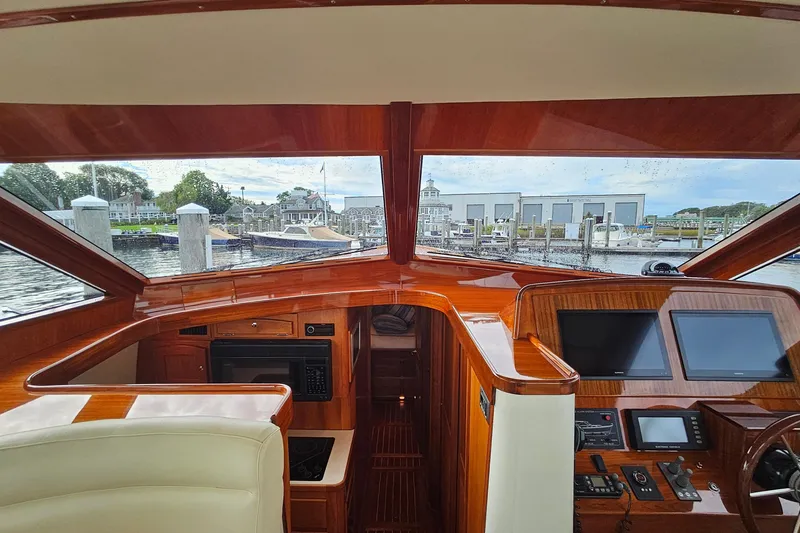 Slide: The Image of Interior view of a 2005 San Juan 48 yacht cockpit with polished wood finish. - 48