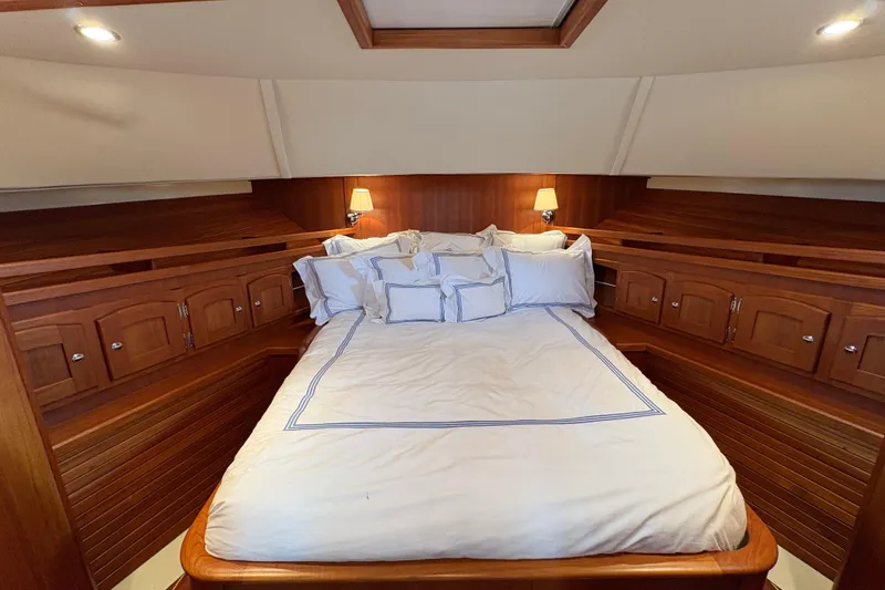 Slide: The Image of Luxurious cabin interior of 2005 San Juan SJ 48 Flybridge yacht with cozy bedding. - 72