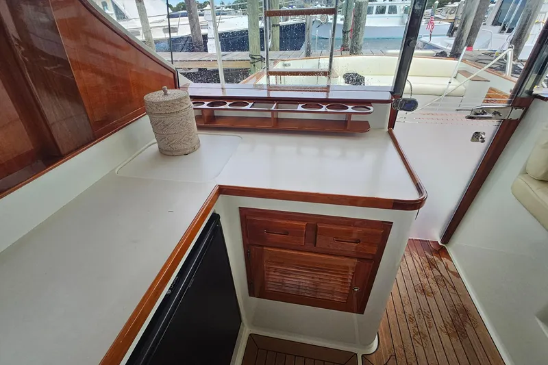 Slide: The Image of Luxurious 2005 San Juan 48 yacht interior with wooden cabinetry and sleek countertop design. - 46