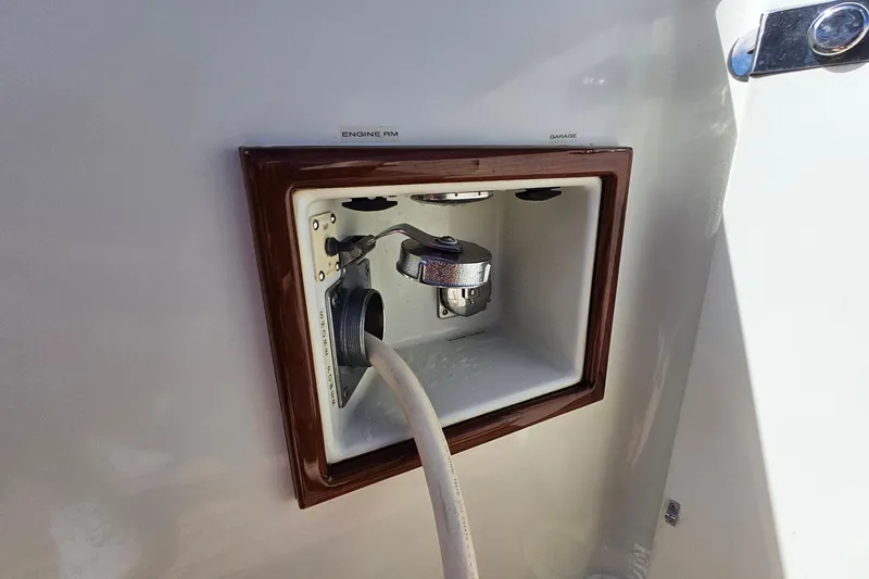 Slide: The Image of San Juan 48 yacht engine room access panel, 2005 model, with hose connection. - 37