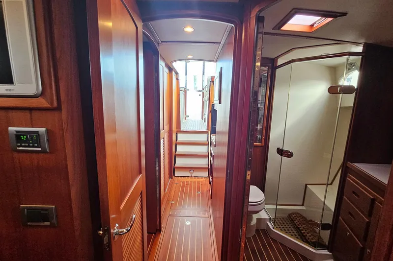 Slide: The Image of Luxurious interior of 2005 San Juan 48 yacht featuring wood paneling and modern amenities. - 75