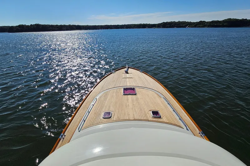 Slide: The Image of 2005 San Juan SJ 48 Flybridge yacht cruising on a sunny, sparkling lake. - 29