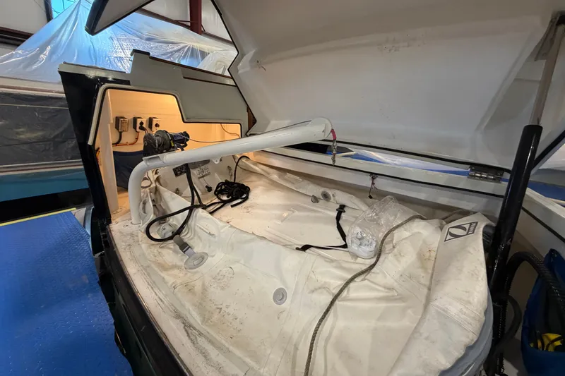 Slide: The Image of Open storage compartment of 2005 San Juan SJ 48 Flybridge boat, showing interior equipment. - 91