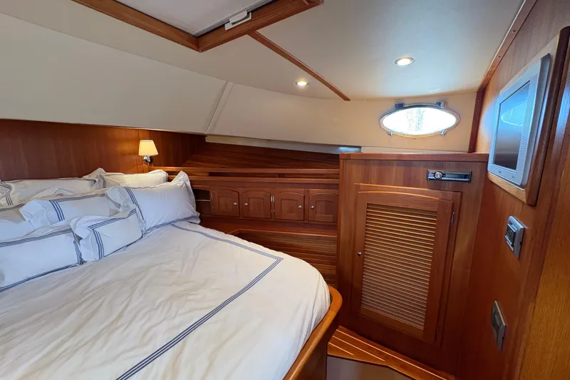 Slide: The Image of Luxurious cabin interior of 2005 San Juan SJ 48 Flybridge yacht with wood finish. - 73
