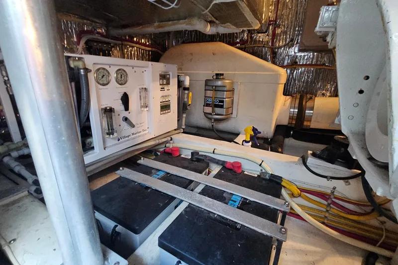 Slide: The Image of Engine room of a 2005 San Juan 48 yacht with control panel and batteries. - 81