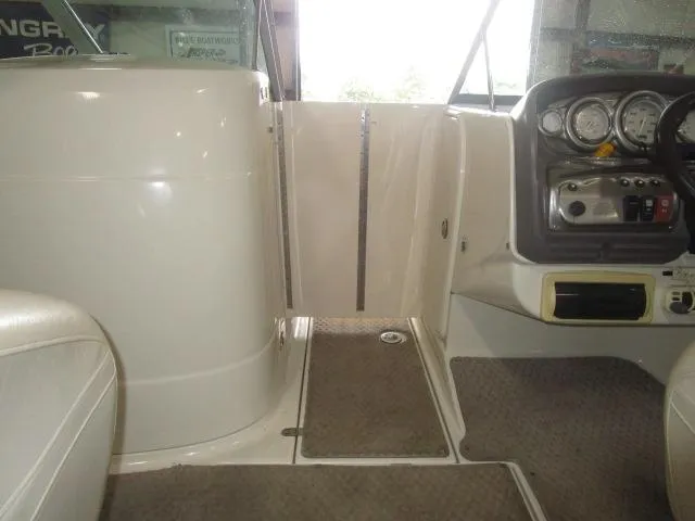 Slide: The Image of 2007 Azure AZ220 deckboat interior with dashboard and seating area. - 10