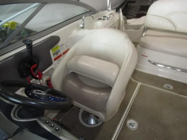 Slide: The Image of 2007 Azure AZ220 deckboat interior with steering wheel and seating area. - 12