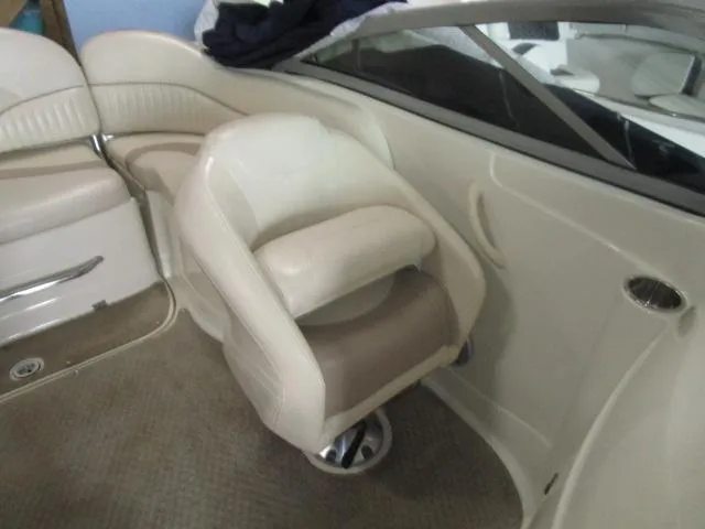 Slide: The Image of 2007 Azure AZ220 deckboat interior with beige seating and carpeted flooring. - 13