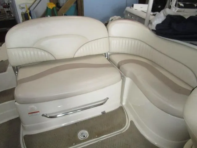 Slide: The Image of 2007 Azure AZ220 deckboat interior with white cushioned seating. - 16