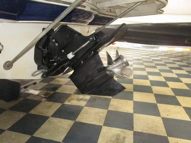 Slide: The Image of 2007 Azure AZ220 deckboat propeller and stern on checkered floor. - 20