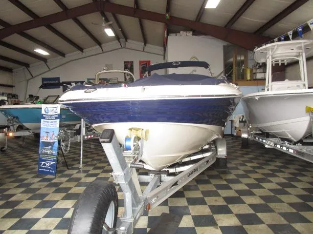 Slide: The Image of 2007 Azure AZ220 deckboat on trailer in showroom with checkered floor. - 3