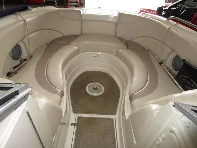 Slide: The Image of 2007 Azure AZ220 deckboat interior with beige seating and spacious layout. - 7