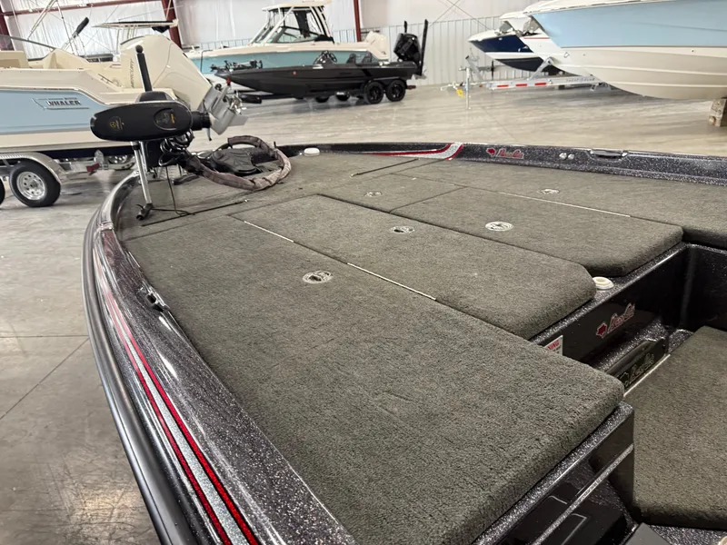 Slide: The Image of 2018 Bass Cat Eyra boat deck with trolling motor in showroom. - 10