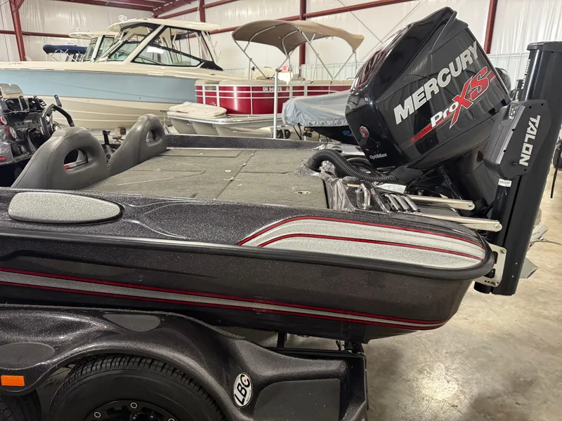 Slide: The Image of 2018 Bass Cat Eyra boat with Mercury Pro XS engine in a showroom. - 3