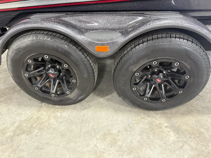 Slide: The Image of 2018 Bass Cat Eyra trailer with black alloy wheels and dual tires. - 5