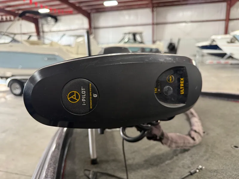 Slide: The Image of 2018 Bass Cat Eyra with i-Pilot Ultrex GPS system in a boat storage facility. - 8