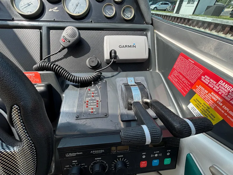 Slide: The Image of Control panel of a 1992 Sea Ray 400 EXPRESS boat with Garmin navigation system. - 12