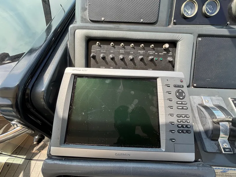 Slide: The Image of Garmin GPS system on 1992 Sea Ray 400 EXPRESS boat dashboard with control panel. - 14