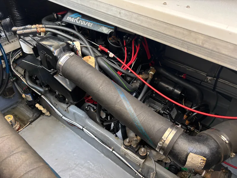 Slide: The Image of Engine compartment of a 1992 Sea Ray 400 EXPRESS with MerCruiser components and red wiring. - 22