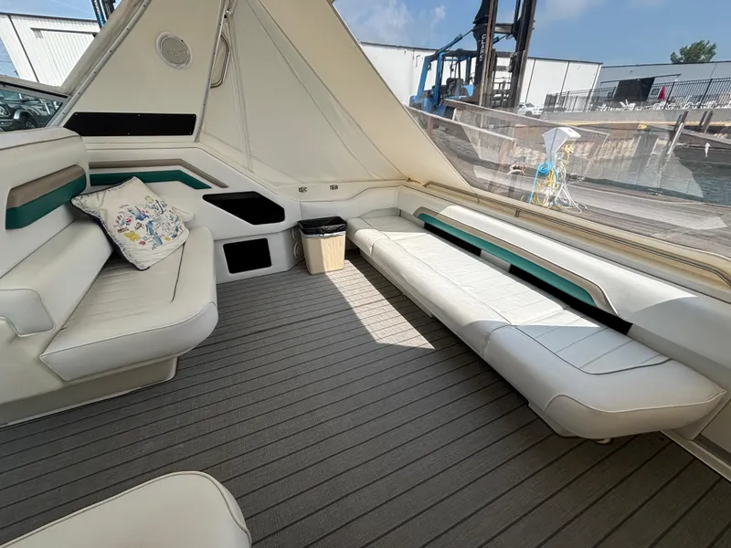 Slide: The Image of Interior of 1992 Sea Ray 400 EXPRESS yacht with white seating and modern design. - 6