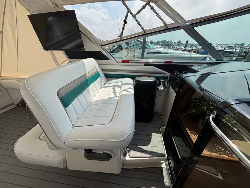 Slide: The Image of Interior of 1992 Sea Ray 400 EXPRESS yacht with white seating and modern amenities. - 9