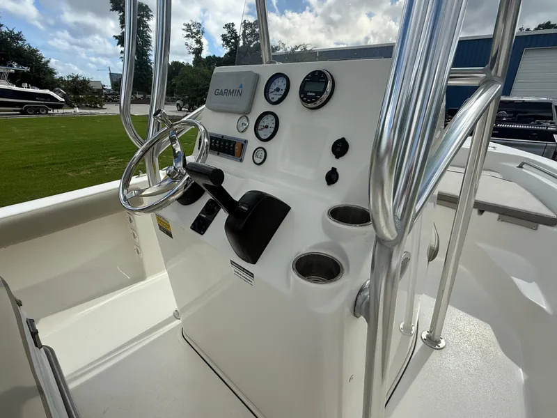 Slide: The Image of 2022 Key West 189FS boat console with Garmin navigation and control gauges. - 10