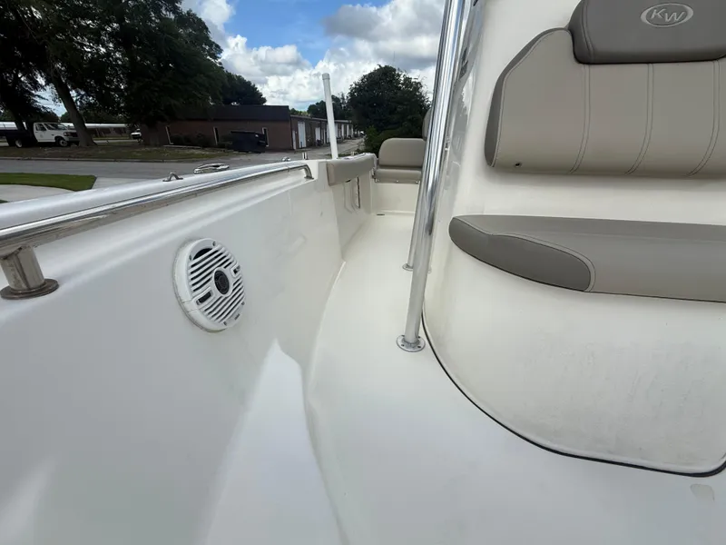 Slide: The Image of 2022 Key West 189FS boat interior with seating and speaker, showcasing sleek design. - 16