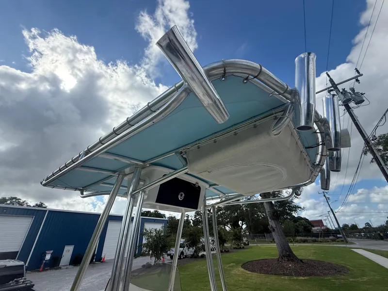 Slide: The Image of 2022 Key West 189FS boat with T-top and rod holders under cloudy sky. - 19